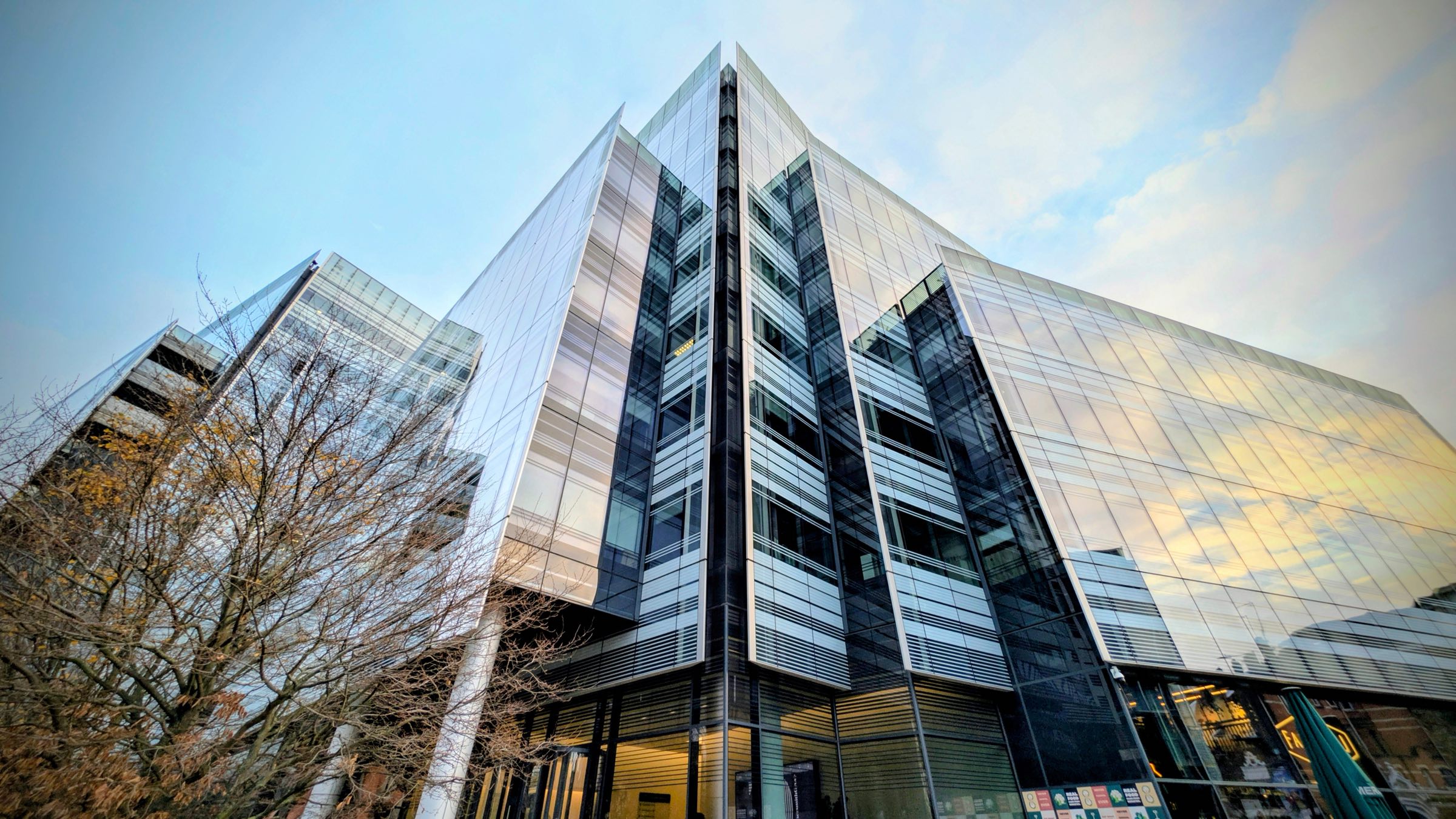 Glass commercial office building seen from below